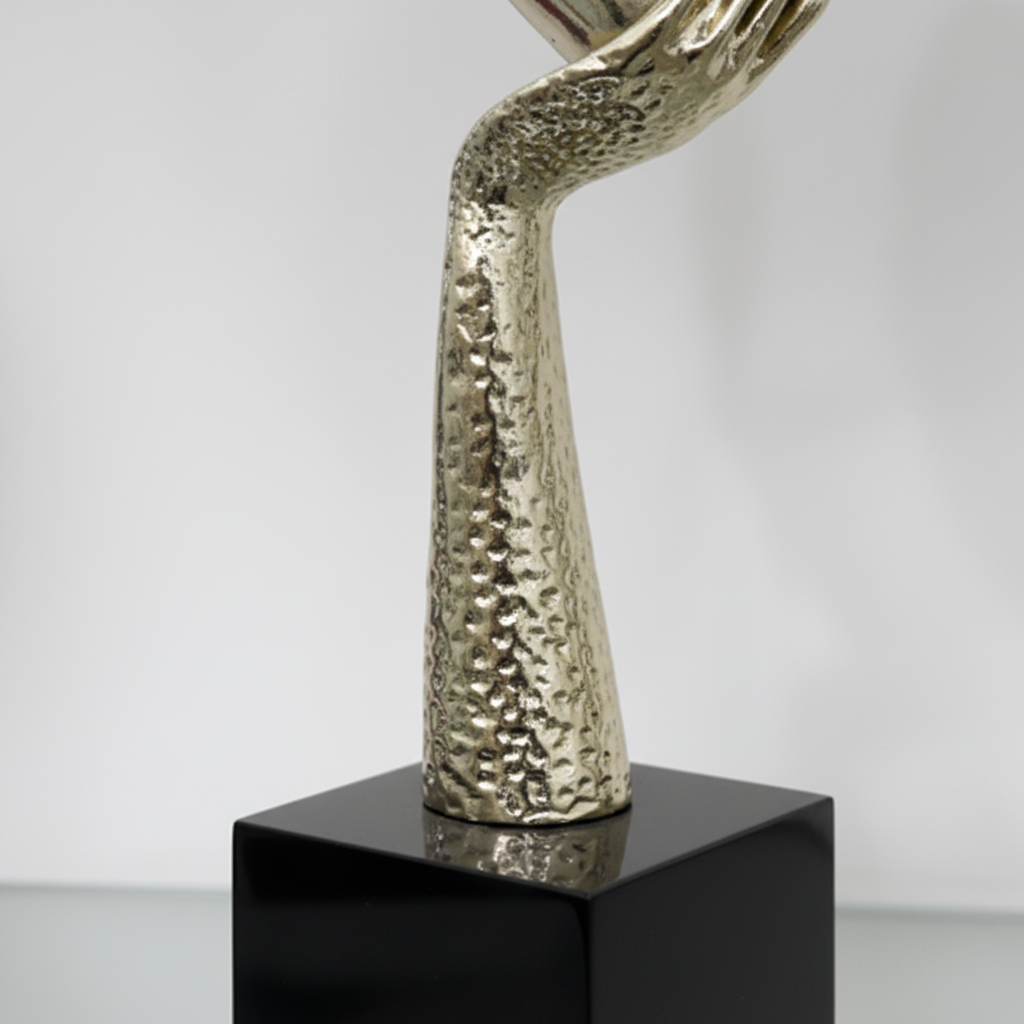 Gold face mask sculpture base and neck texture close up