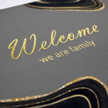 Welcome We Are Family Door Mat - Close-up Gold Text Detail