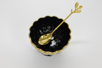 Black Gold Ceramic Bowl Top View with Gold Flower Spoon White Background