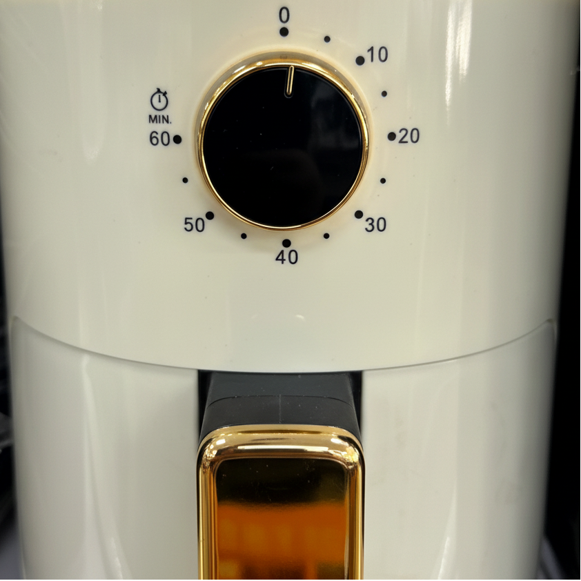 Cream gold air fryer - close-up gold knob and handle