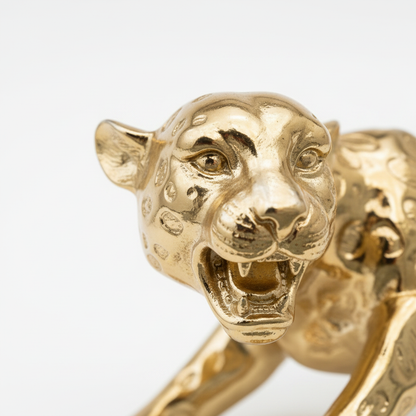 Gold leopard figurine head face close up detail